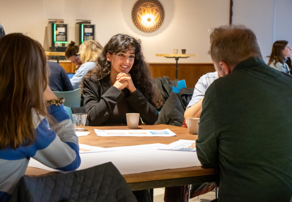 Deelnemers bespreken in een kleine groep de vier hoofdthema’s voor het N!D jaarplan 2026.